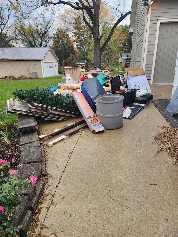 Dumpster being loaded with debris for Commercial Dumpster Rental in Cartersville
